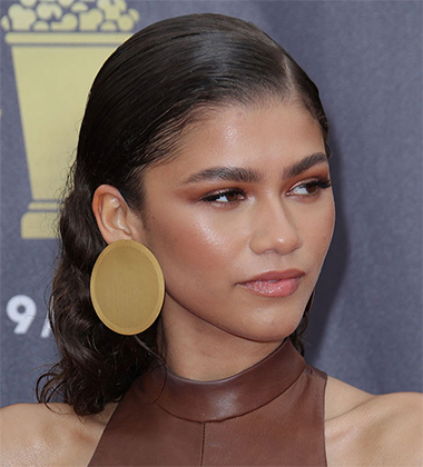 Zendaya with gelled back hair