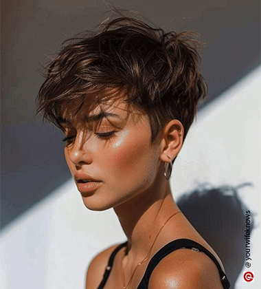 woman with a pixie cut and golden hoops