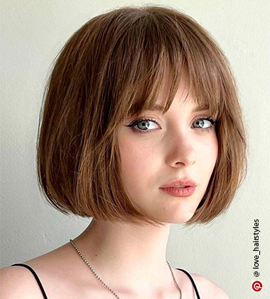 green-eyed woman with bob haircut