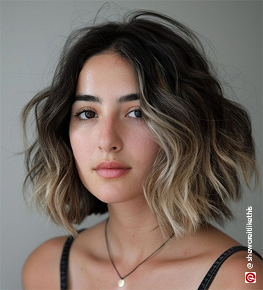 woman wearing a pendant and sleeveless top with a bob