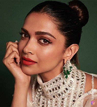 Deepika padukone with a green background