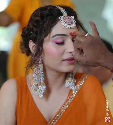 Woman in monochrome pink makeup