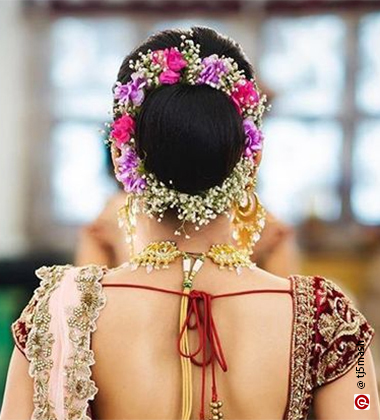 Reception Hairstyles for Saree – Bun with Baby’s Breath